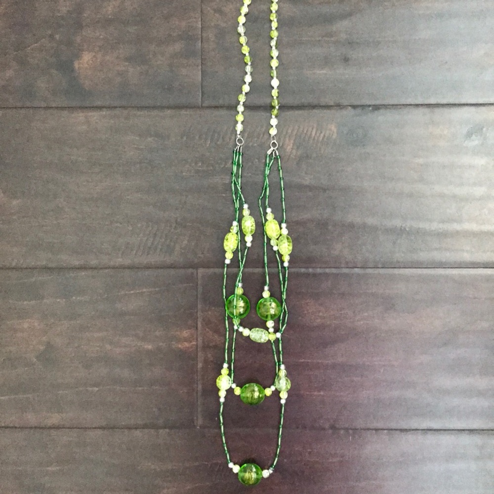 Very long green necklace with bead charms
